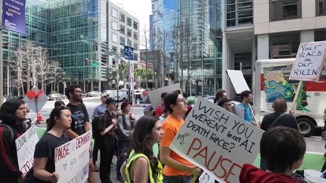 Protesters advocating for a pause on AI development as new safety frameworks arise.