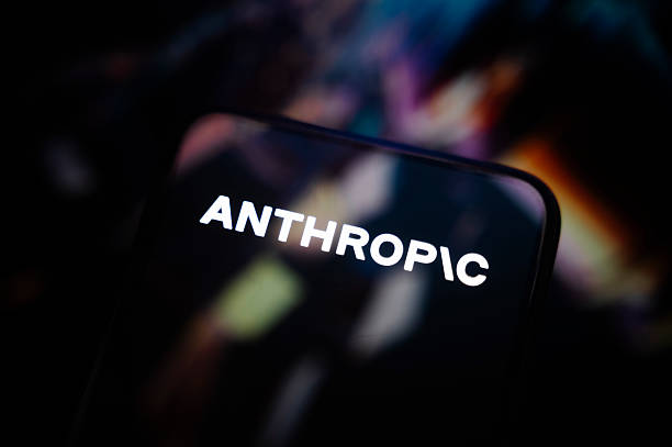 This photograph shows a smartphone screen displaying the logo of Anthropic, an American company specializing in artificial intelligence . It develops...